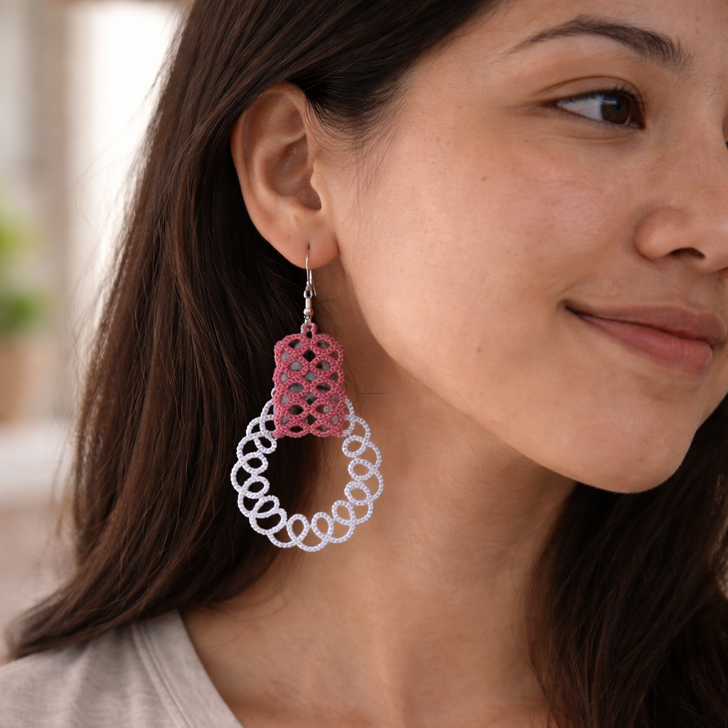 Close-up of a woman wearing pink and white earrings.